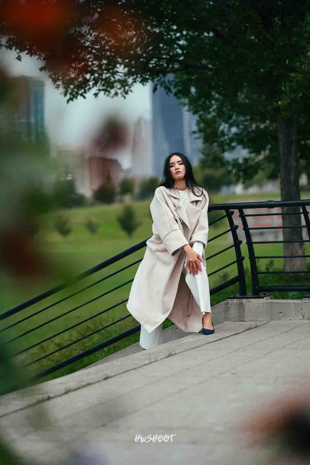 Model posing outdoors in green knitwear