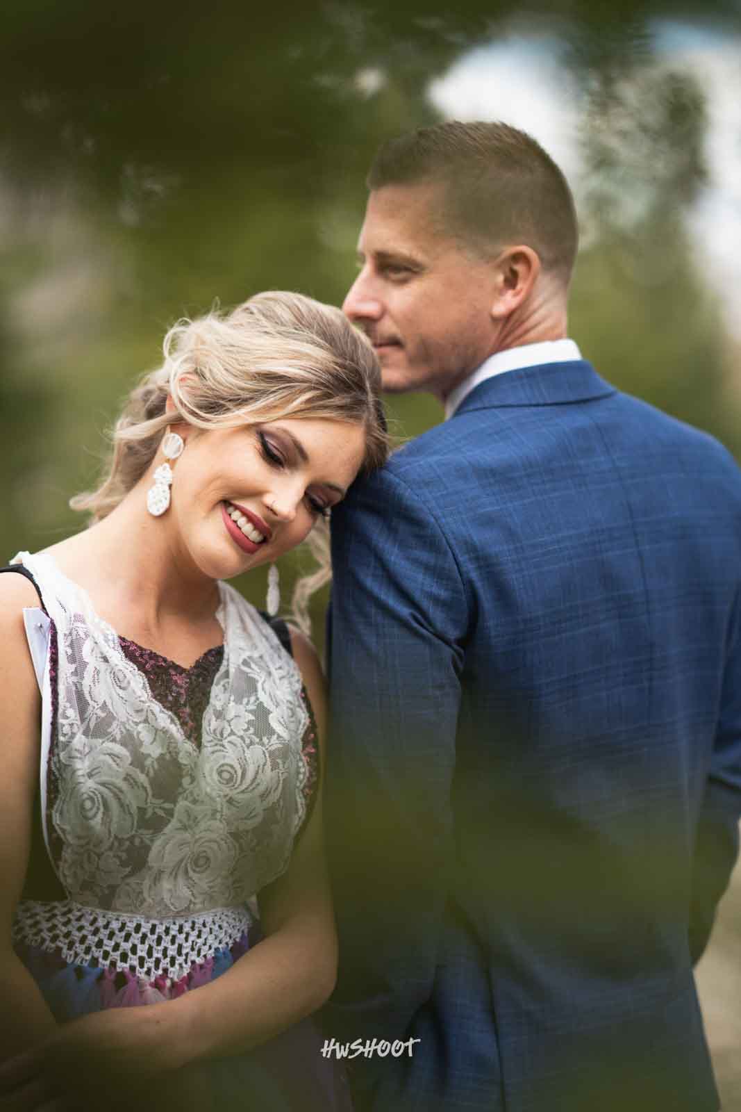 Woman leaning on her partner during an outdoor portrait session