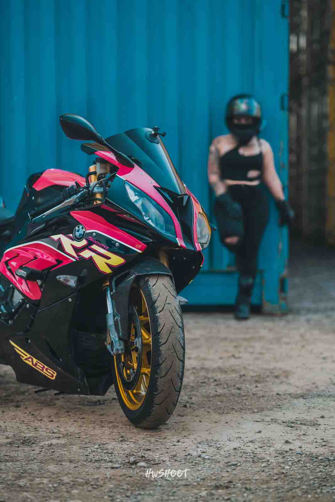 Female motorcycle rider portrait with BMW S1000RR in Calgary